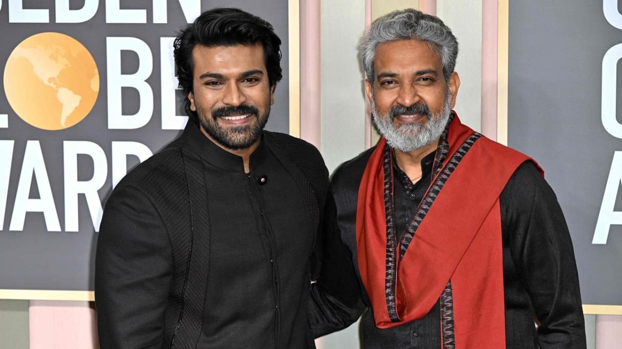 'RRR' director SS Rajamouli (R) and actor Ram Charan at the Golden Globe Awards. Credit: AFP Photo