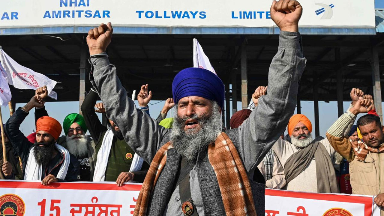 Farmers protest at Punjab toll plaza. Credit: AFP Photo