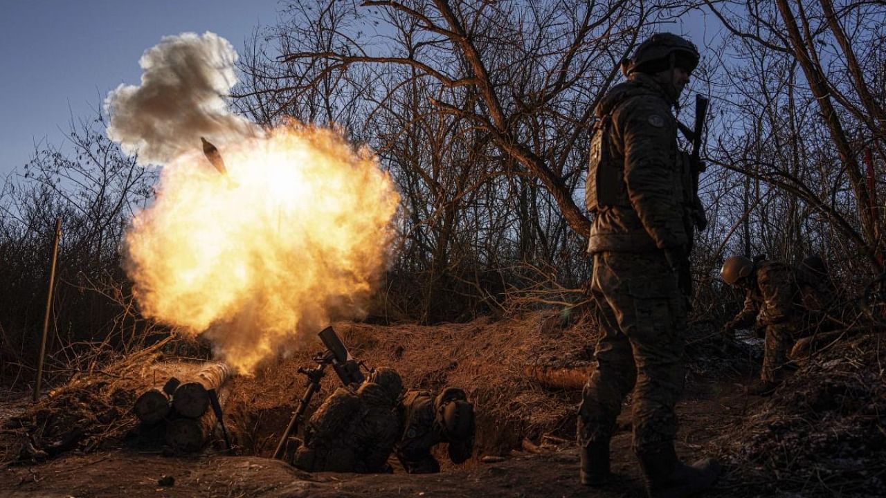 Ukrainian servicemen fire a 120 mm mortar towards Russian positions at the frontline near Bakhmut, Donetsk region, Ukraine, Wednesday, Jan. 11, 2023. Credit: AP/PTI Photo