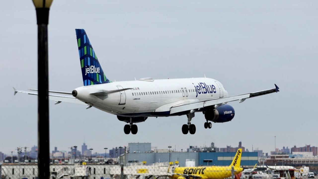 A JetBlue Airways jet comes in for a landing after flights earlier were grounded during an FAA system outage across US. Credit: Reuters