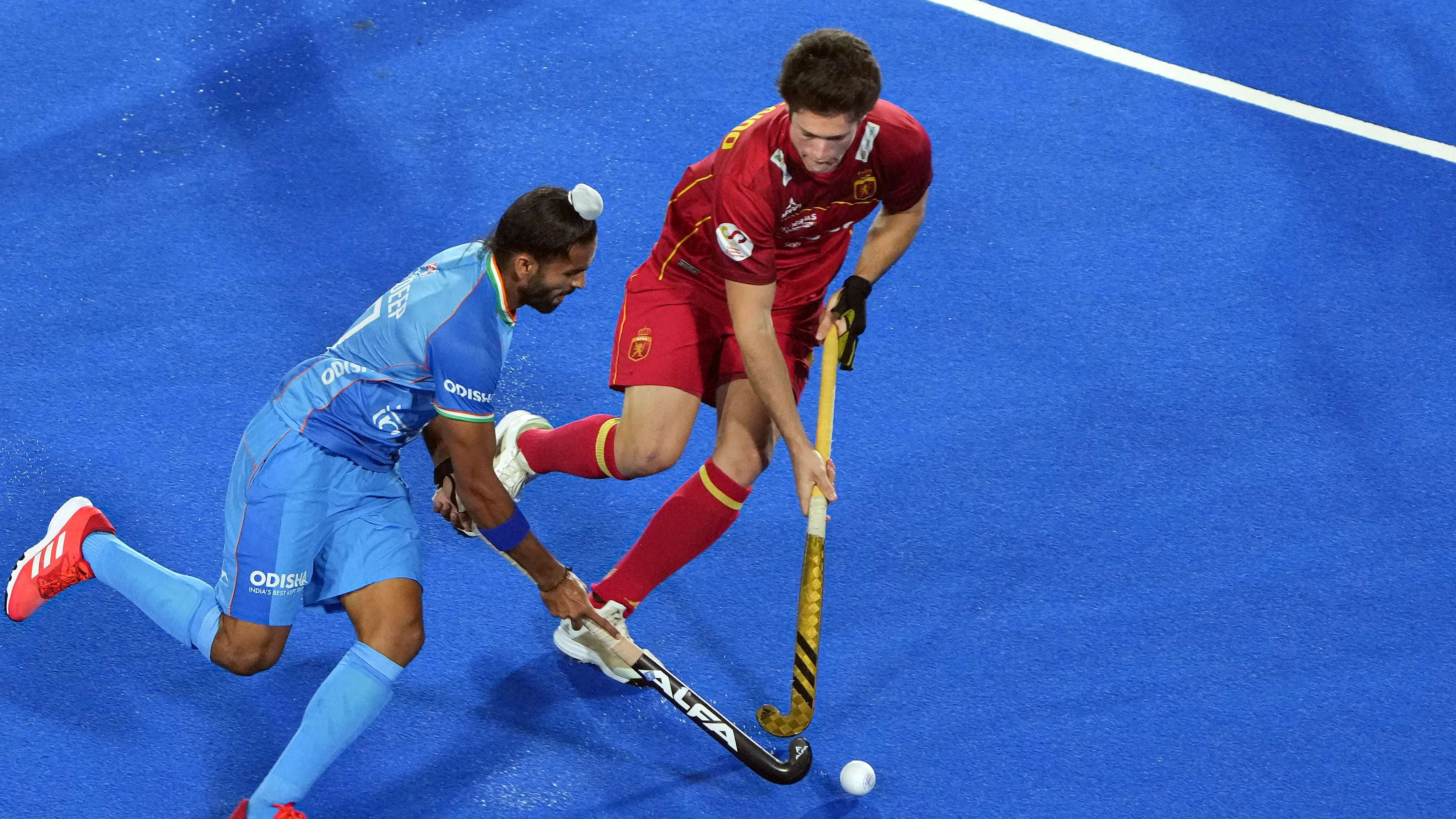  Akashdeep Singh of India vies for the ball with a Spain defender. Credit: PTI Photo