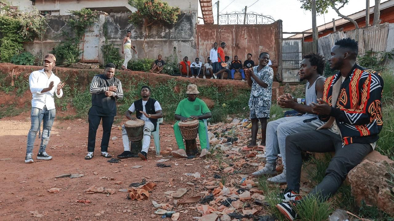 A group of young Mbolé artists gather in a stadium during an improvisation session in the Mvog-Ada district in Yaounde. Credit: AFP Photo