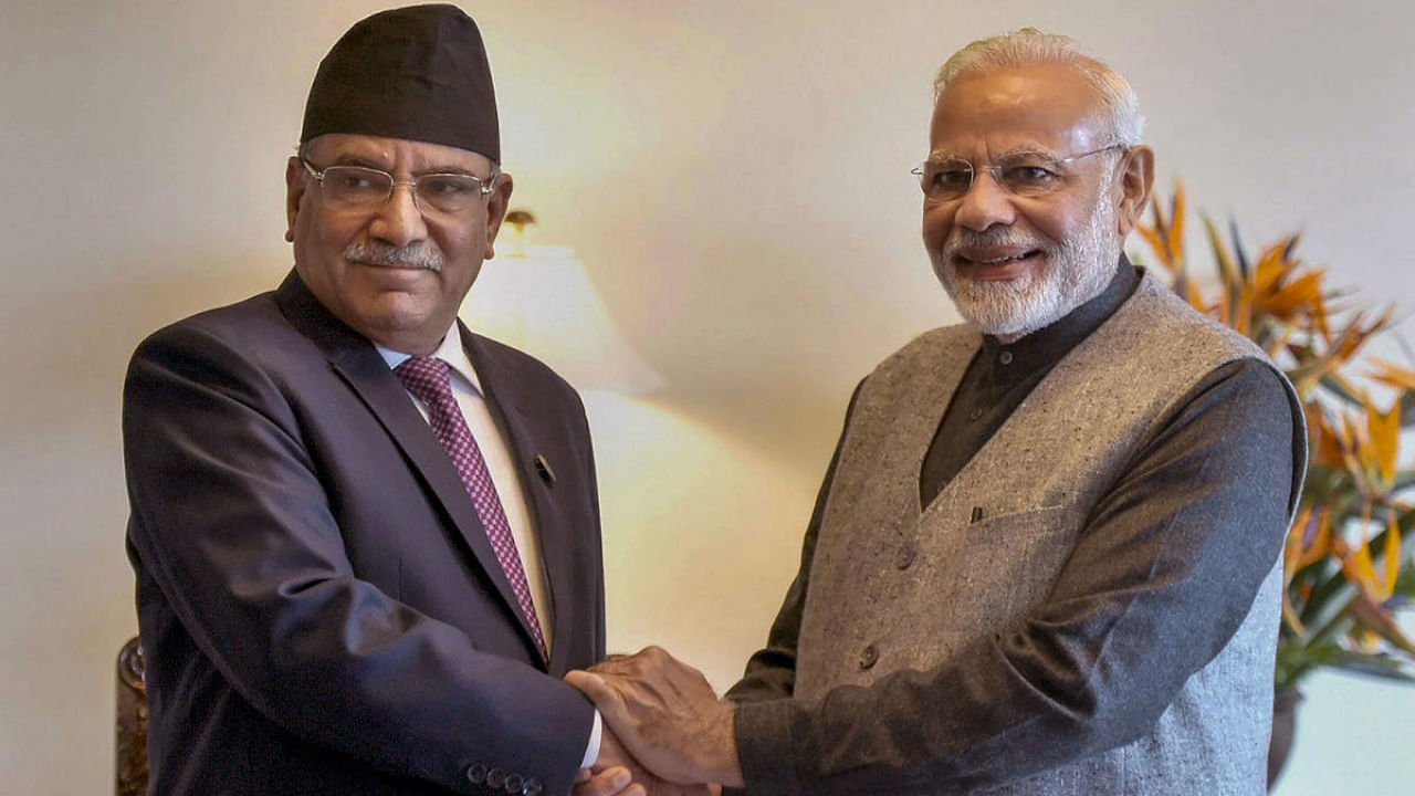 Indian Prime Minister Narendra Modi (right) with Nepal Prime Minister Pushpa Kamal Dahal (left). Credit: PTI Photo