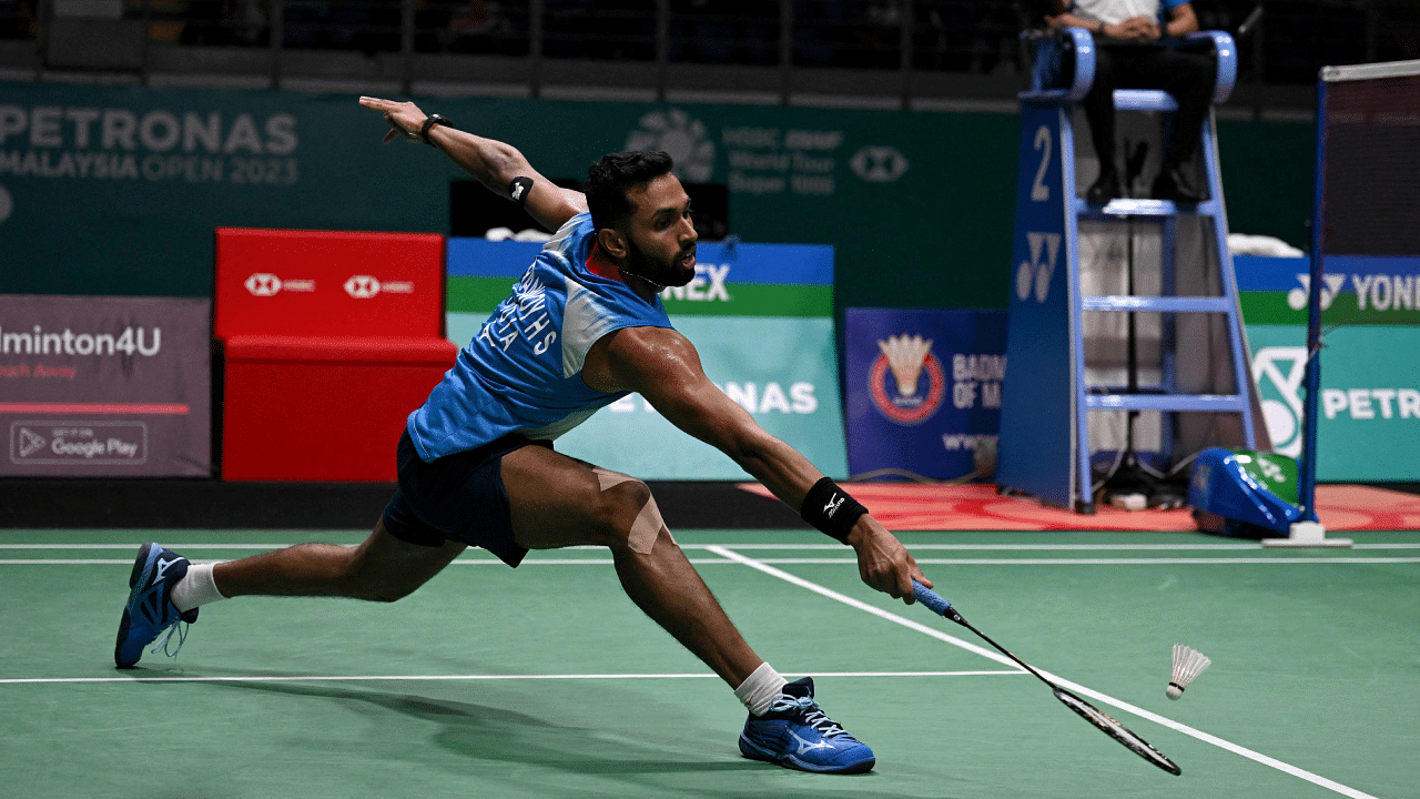 H S Prannoy reaches for a return against Japan’s Kodai Naraoka during their men’s singles quarter-finals match at the Malaysia Open badminton tournament in Kuala Lumpur. Credit: AFP Photo