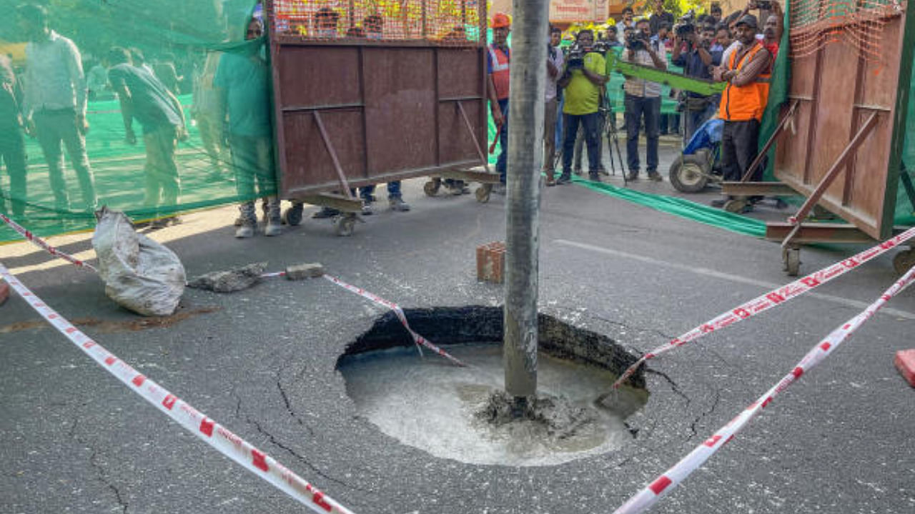 The sink hole which surfaced near Shoolay Circle, Brigade Road, is filled with concrete on Thursday. Credit: DH Photo/S K Dinesh