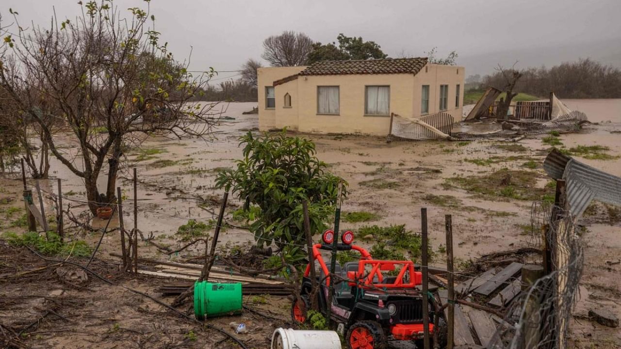 Flood waters inundate a home by the Salinas River near Chualar, California. Credit: AFP Photo