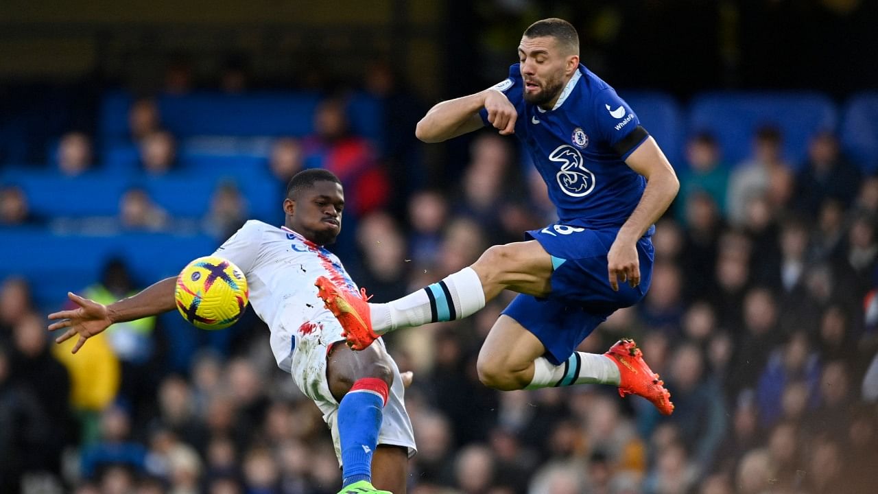 Chelsea's Mateo Kovacic in action with Crystal Palace's Cheick Doucoure. Credit: Reuters Photo