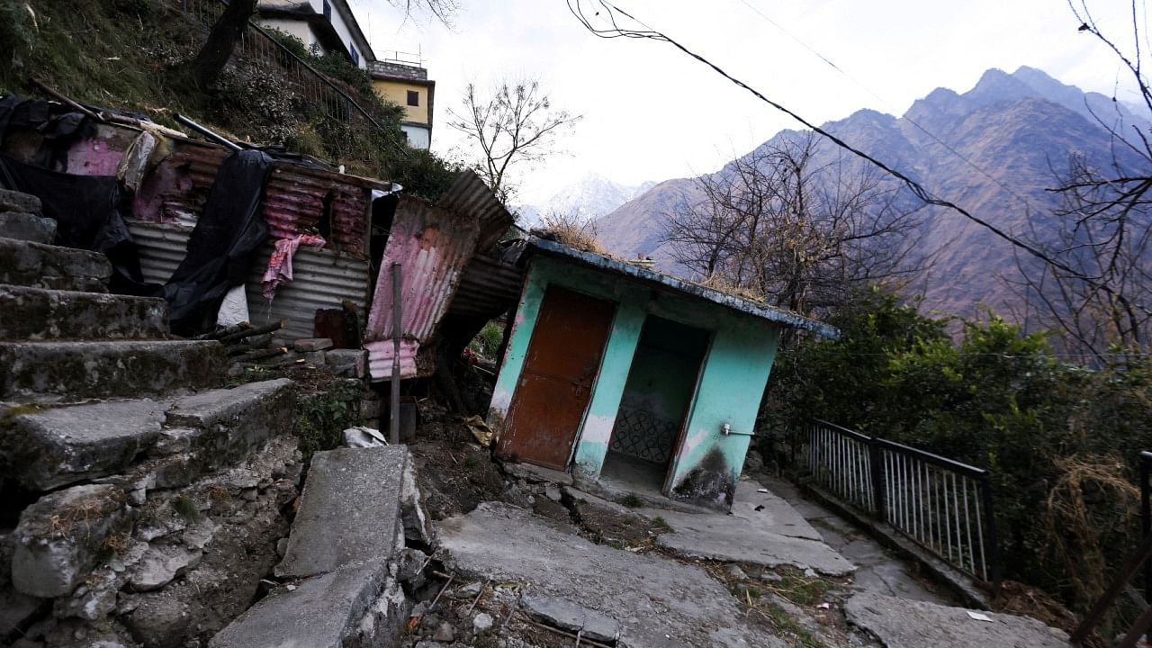 Damaged stairs leading to a residential building and a tilted room are seen in Joshimath, in the northern state of Uttarakhand, India, January 13, 2023. Credit: PTI Photo