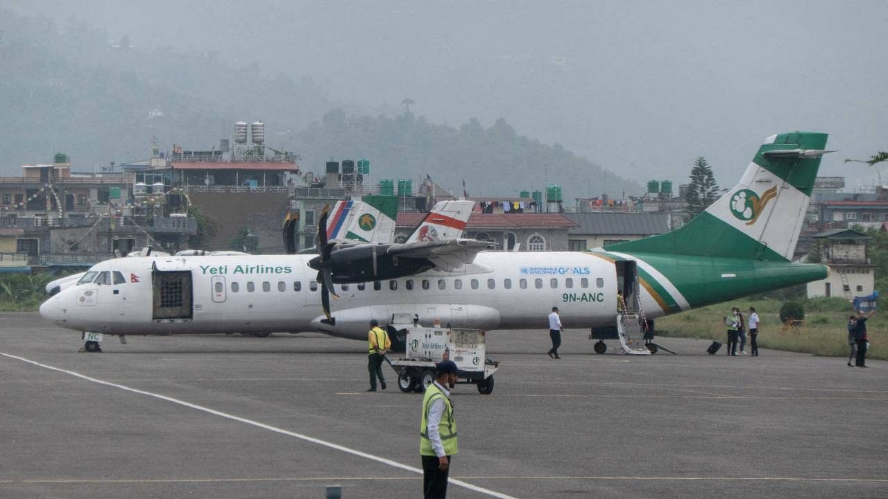 While landing at the Pokhara airport around 11 am on Sunday, the Yeti Airlines aircraft crashed on the bank of the Seti River between the old airport and the new airport. Credit: Reuters Photo