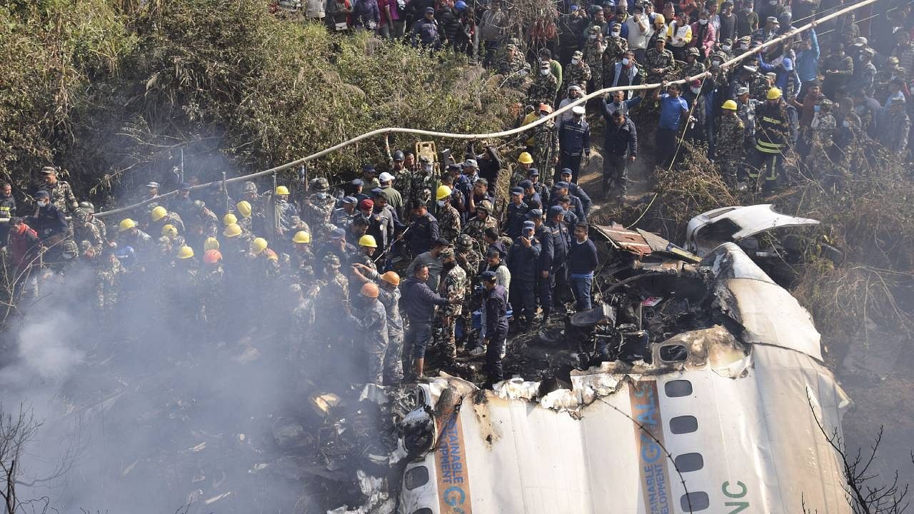 At least 68 people were killed when a Yeti Airlines passenger plane with 72 people onboard, including five Indians, crashed into a river gorge while landing at the newly-opened airport in central Nepal's resort city of Pokhara on Sunday. Credit: AP/PTI Photo