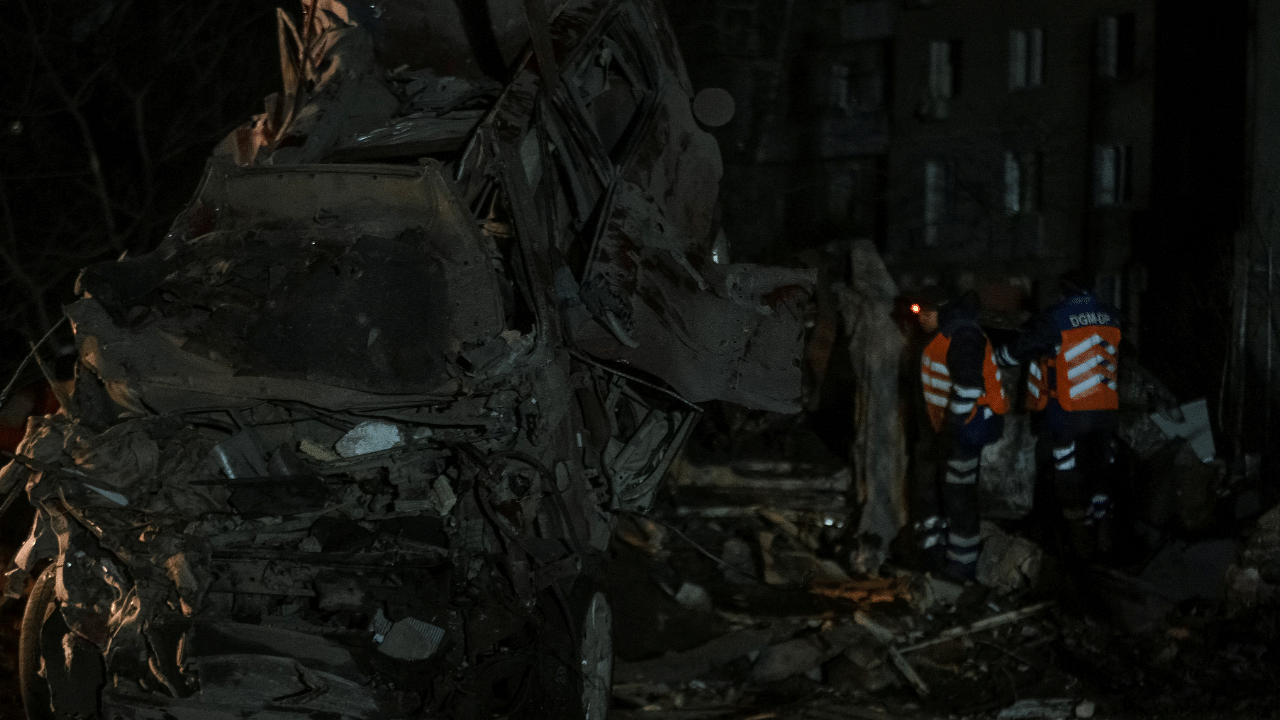 Rescuers work at the site where an apartment building was heavily damaged by a Russian missile strike, amid Russia's attack on Ukraine, in Dnipro, Ukraine. Credit: Reuters Photo