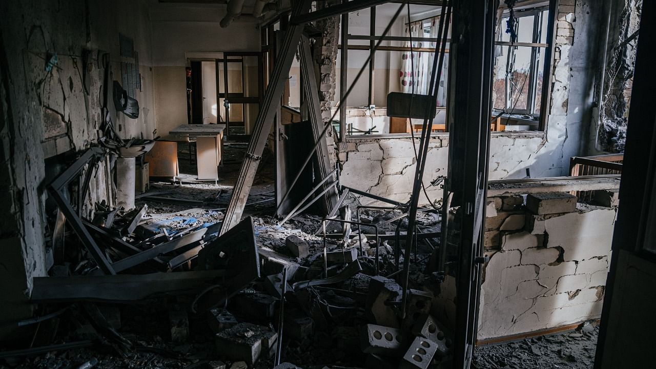 This photograph taken on January 1, 2023, shows an inside view of a damaged room at the regional Children’s Hospital after a Russian missile strike in the southern city of Kherson. Credit: AFP Photo