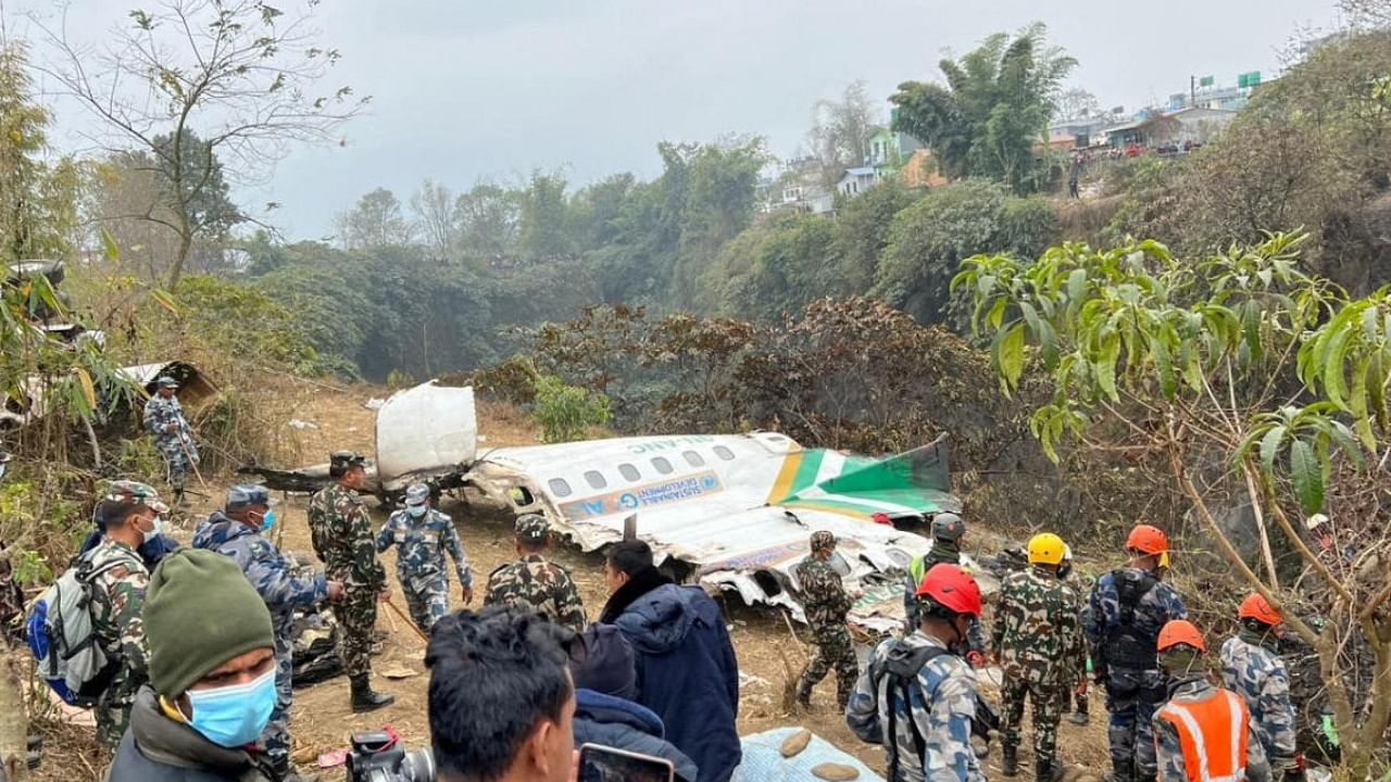 Rescuers inspect the wreckage at the site of a Yeti Airlines plane crash in Pokhara. Credit: AFP