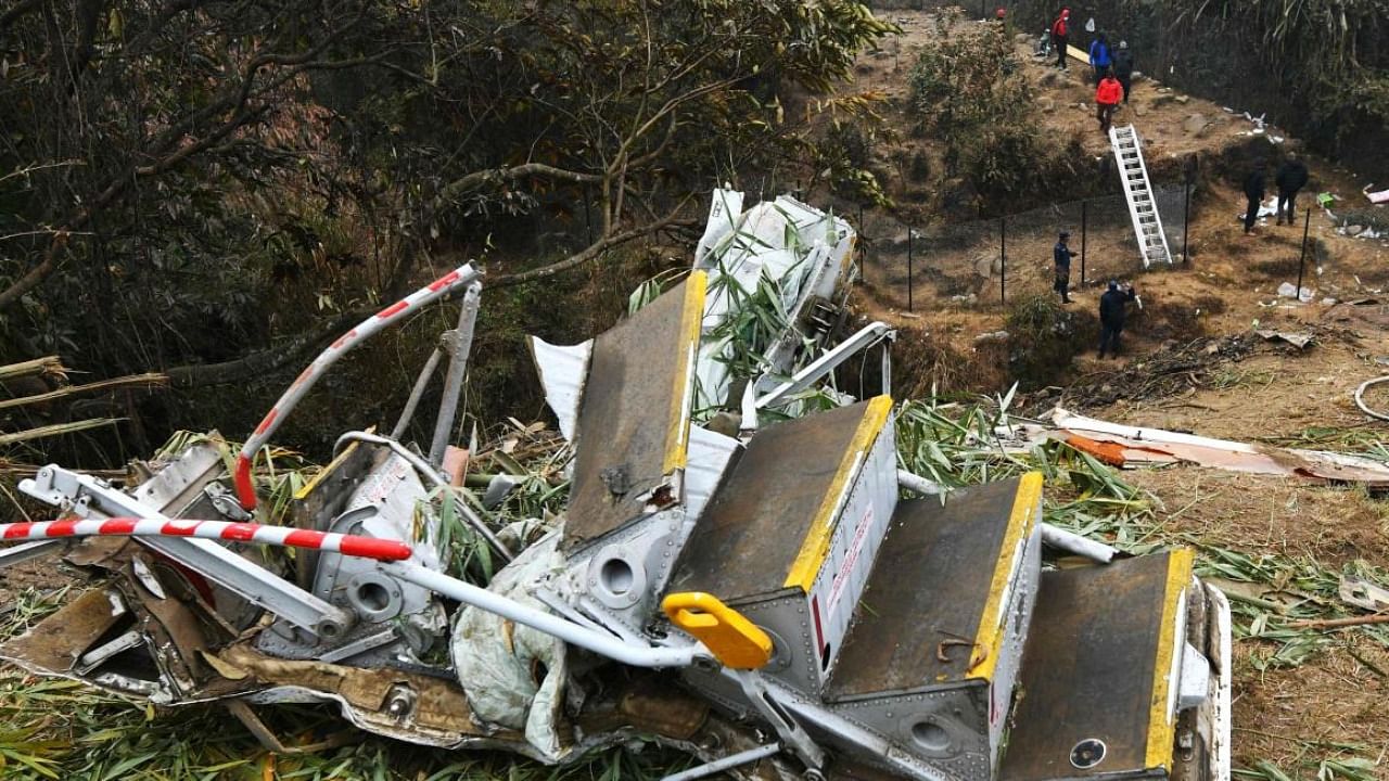Rescuers inspect the wreckage at the site of a Yeti Airlines plane crash in Pokhara. Credit: AFP Photo