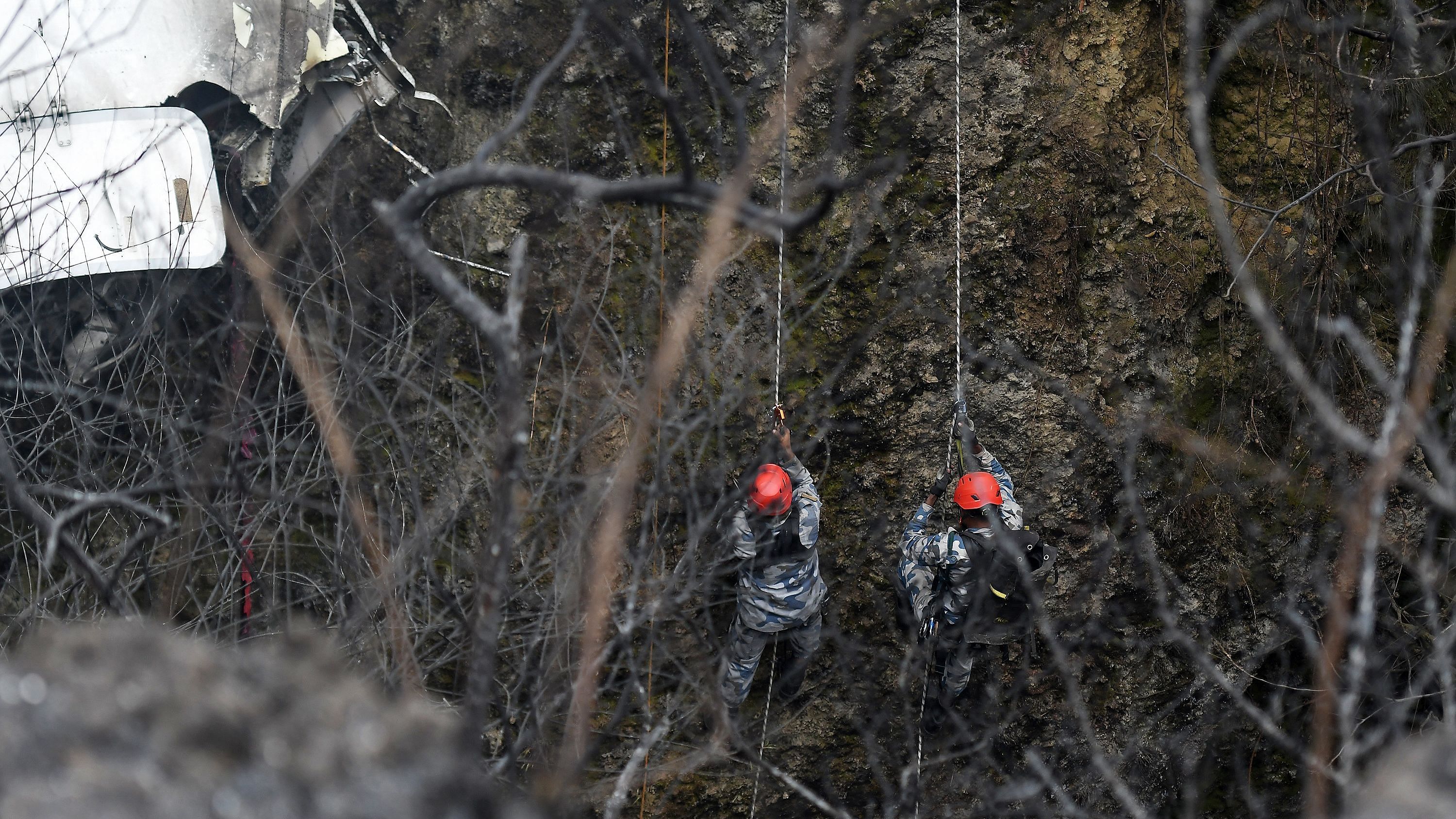 Rescuers inspect the wreckage at the site of a Yeti Airlines plane crash in Pokhara. Credit: AFP Photo