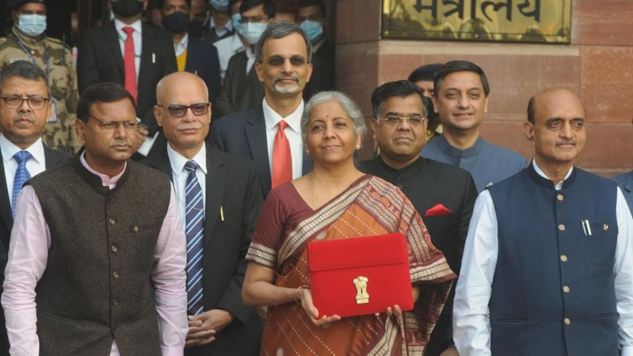 Union Finance Minister Nirmala Sitharaman with MoS Finance Pankaj Chaudhary and Dr Bhagwat Kishanrao Karad and other officials leave from the Ministry of Finance to present and read out the Budget 2022 at Parliament, in New Delhi on Tuesday, February 01, 2022. Credit: IANS Photo