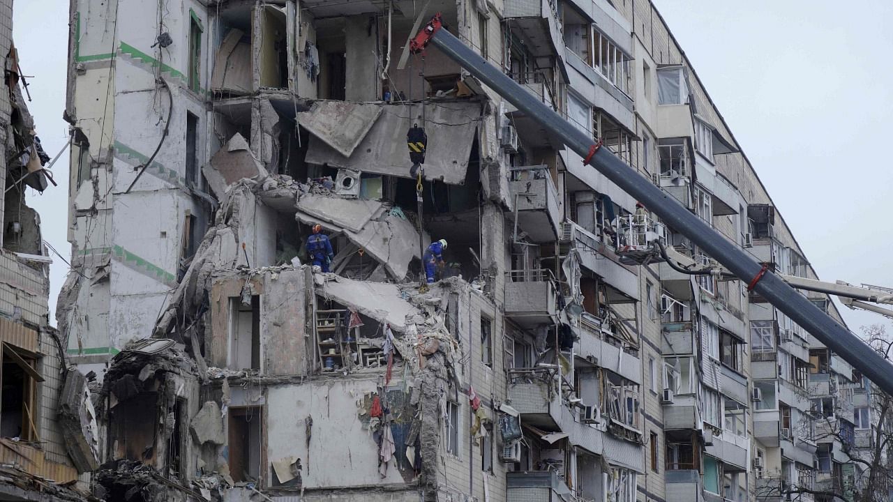 Rescuers work on a residential building destroyed after a missile strike, in Dnipro. Credit: AFP Photo