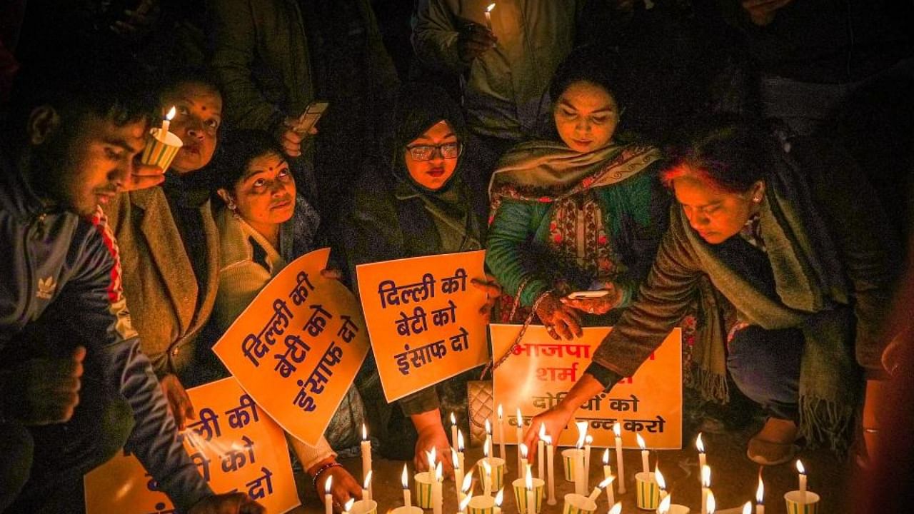 AAP activists light candles during a march demanding justice for Anjali Singh, a 20-year-old woman who was killed after being hit and dragged by a car, at Jantar Mantar in New Delhi. Credit: PTI Photo