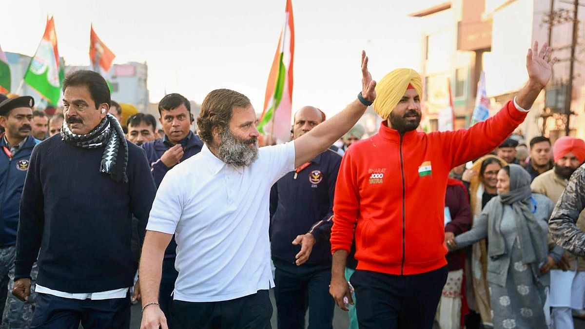 Congress leader Rahul Gandhi waves at supporters during the party's Bharat Jodo Yatra, in Hoshiarpur district. Credit: PTI Photo