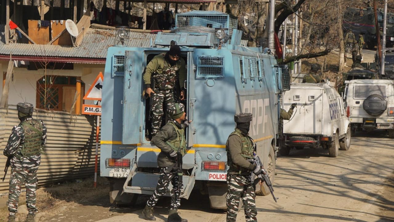  Security personnel stand guard during an encounter with terrorists in Budgam. Credit: PTI File Photo