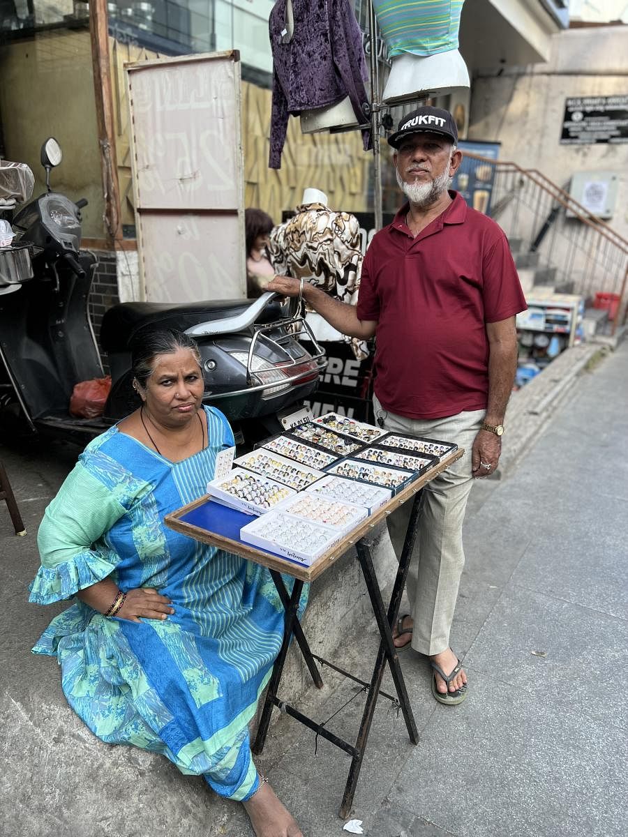 Despite the risk of being driven away, Mumtaz and Babu continue to sell jewellery and antique items in a corner.