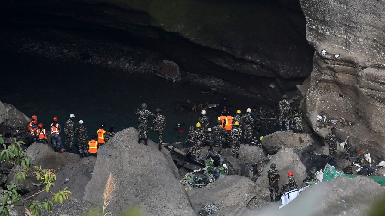 Rescue teams search for victims at the site of the Yeti Airlines plane crash, in Pokhara on January 17, 2023. Credit: AFP Photo