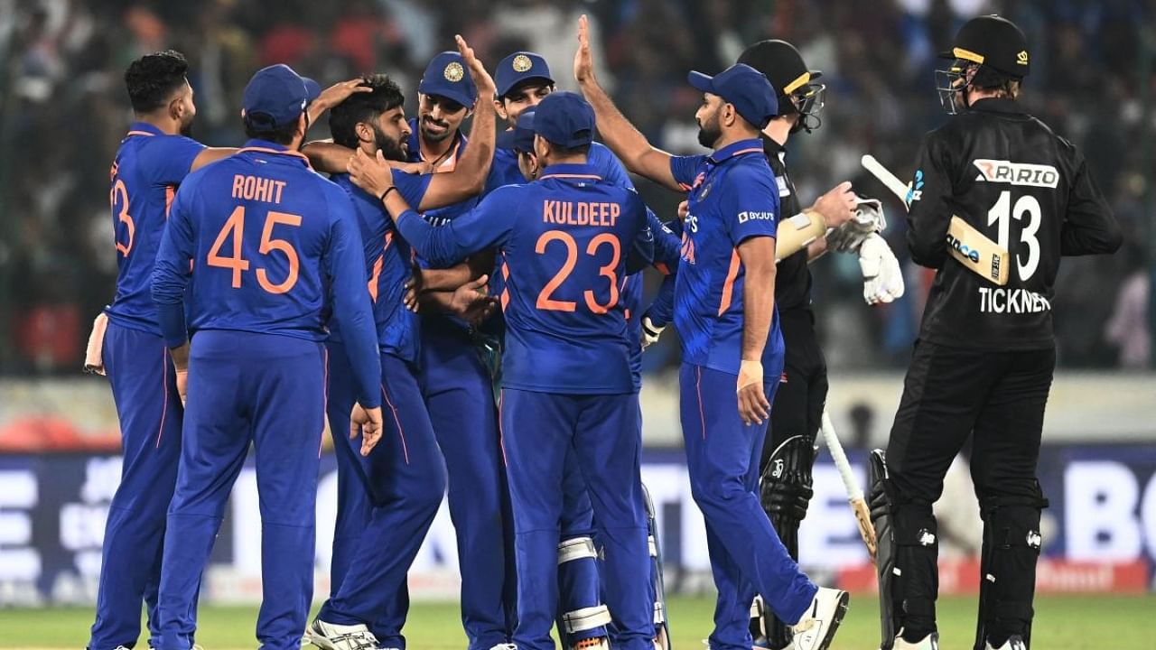 India cricketers celebrate their win at the end of the first one-day international (ODI) cricket match between India and New Zealand at the Rajiv Gandhi International Cricket Stadium in Hyderabad. Credit: AFP Photo