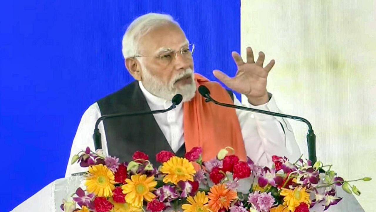 PM Modi speaks during the inauguration and foundation stone laying ceremony of various development projects, at Kodekal in Yadgiri district. Credit: PTI Photo