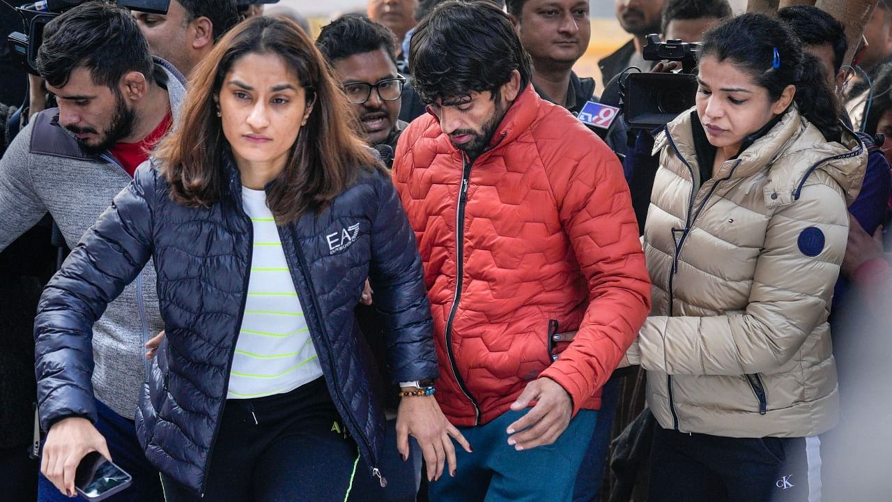 Wrestlers Vinesh Phogat, Sakshi Malik and Bajrang Punia arrive to sit on 'dharna' to protest against the Wrestling Federation of India (WFI), at Jantar Mantar in New Delhi, Thursday, Jan. 19, 2023. Credit: PTI Photo