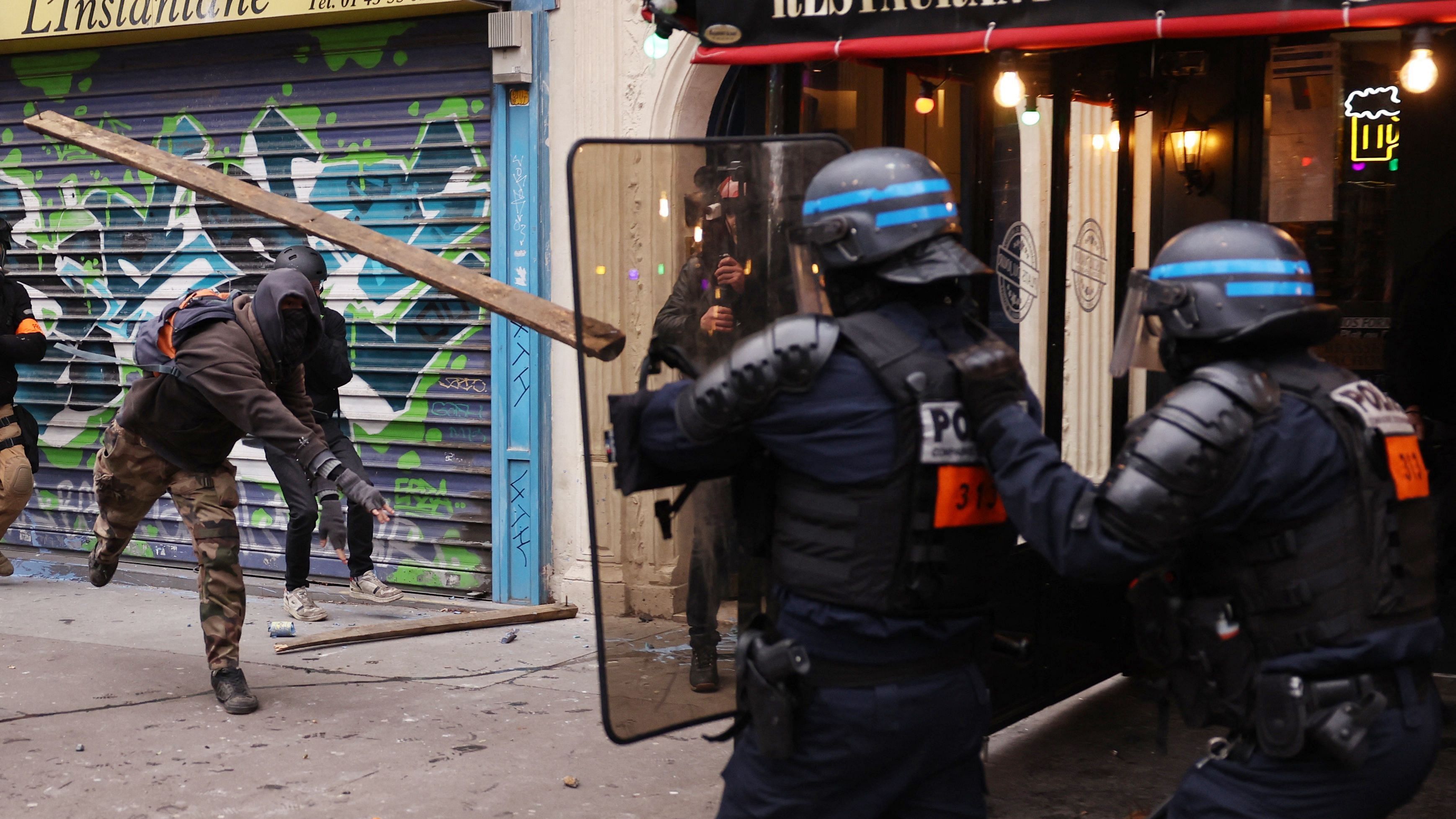 Protester clashes with police during a rally in Paris on January 19, 2023. Credit: AFP Photo