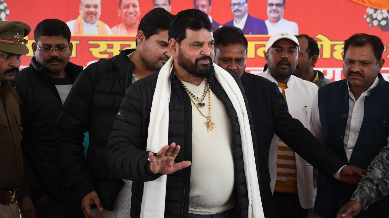 Wrestling Federation of India (WFI) president Brij Bhushan Sharan Singh (C) arrives to address a press conference in Gonda on January 20, 2023, following allegations of sexual harassment to wrestlers by members of the WFI. Credit: AFP Photo