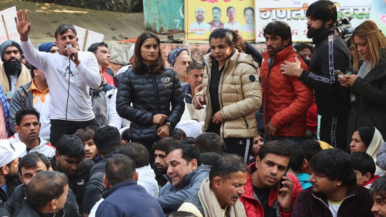 <div class="paragraphs"><p>File Photo: Vinesh Phogat, Sakshi Malik, Bajrang Punia and other Indian wrestlers take part in a protest demanding the disbandment of the WFI and the investigation of its head by the police, who they accuse of sexually harassing female players, at Jantar Mantar in New Delhi, India, January 19, 2023. </p></div>