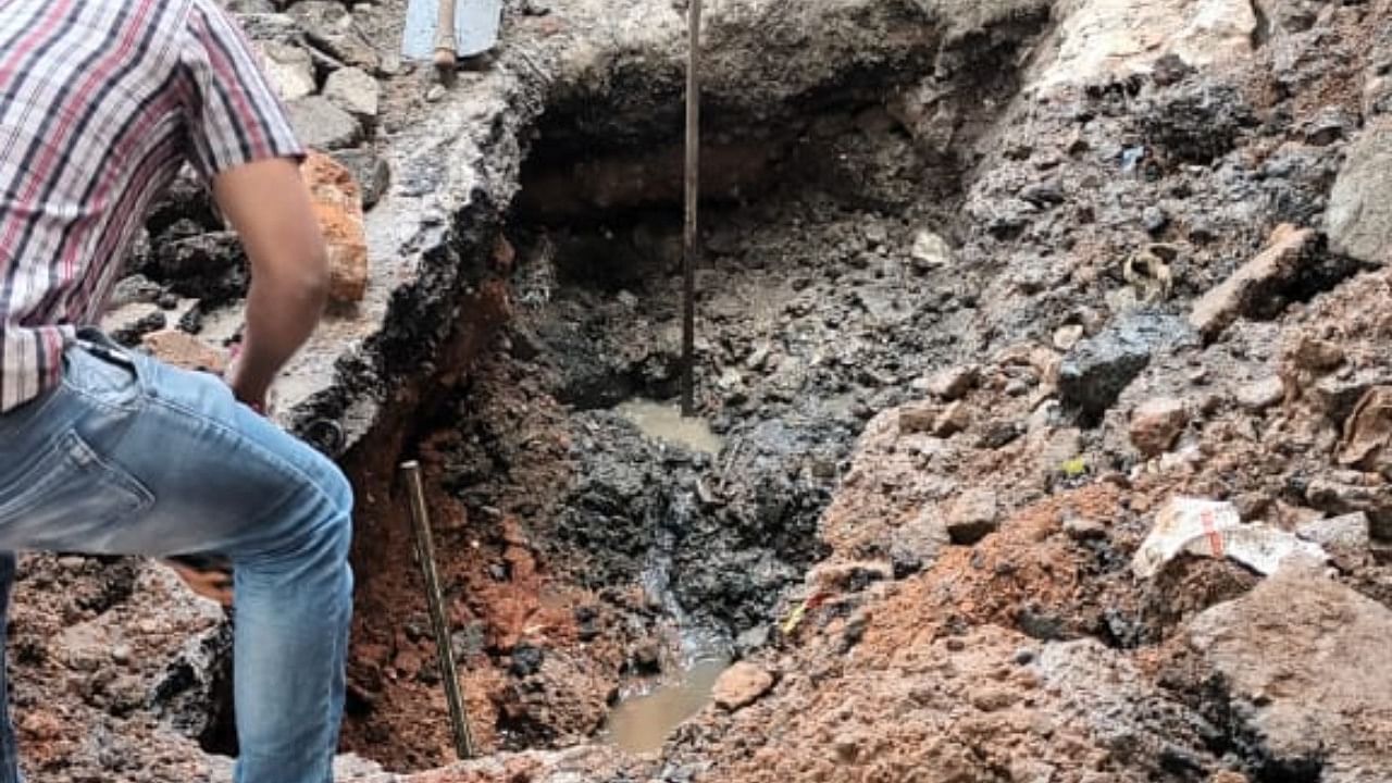 The three-feet-deep sinkhole appeared owing to a leakage of a water pipeline beneath it, BBMP officials said. Credit: Special Arrangement