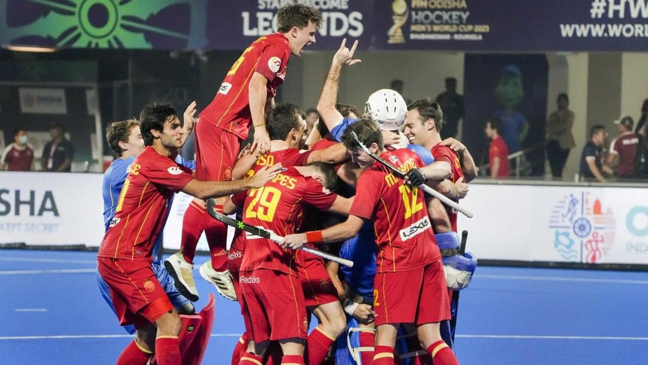 Spanish players celebrate after winning in a shootout during the match between Spain and Malaysia in the 2023 Men's FIH Hockey World Cup. Credit: PTI