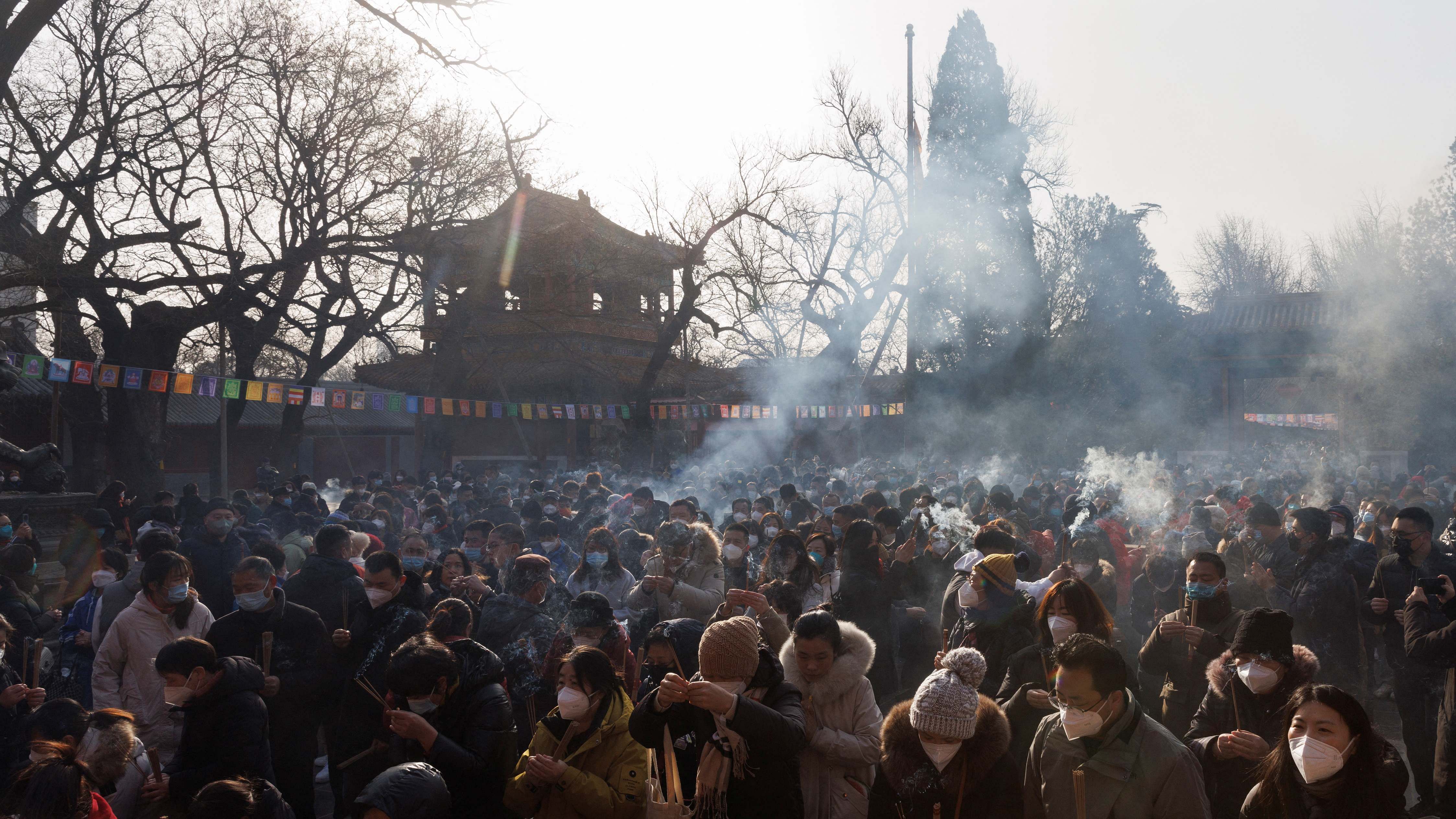 People pray at Lama Temple (Yonghe Temple) on the first day of the Lunar New Year of the Rabbit in Beijing, China. Credit: Reuters Photo