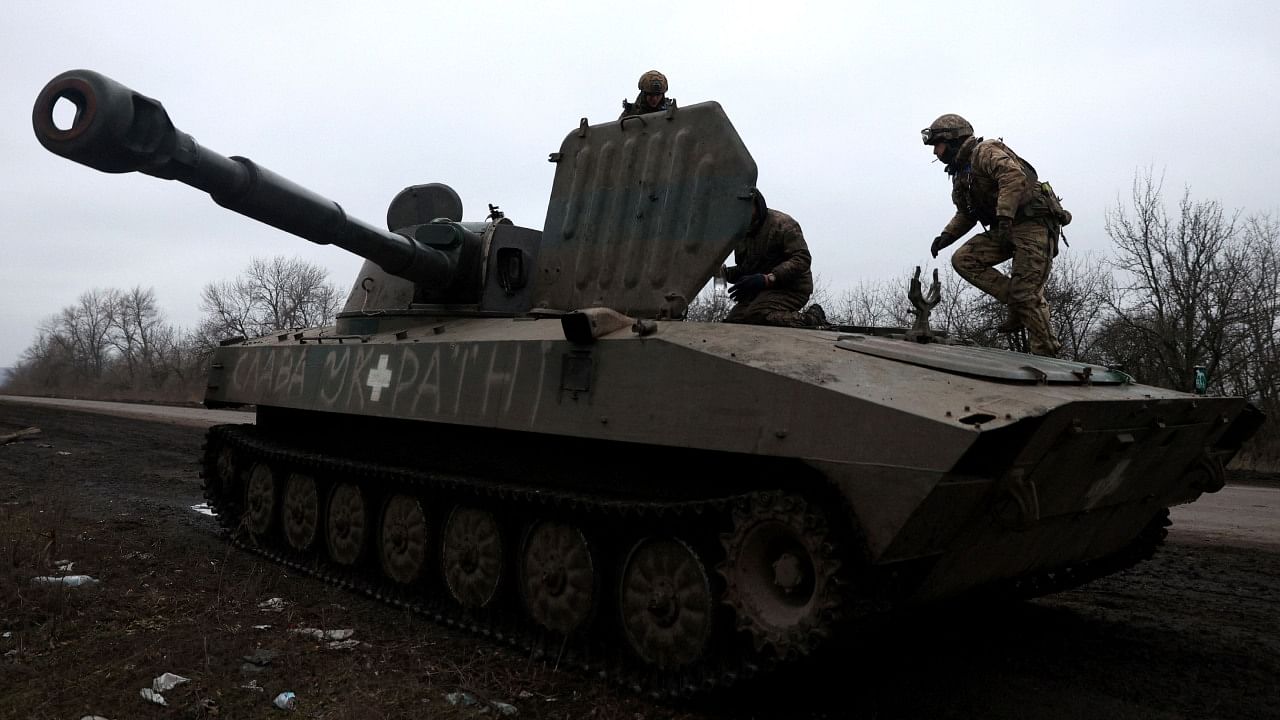 Ukrainian artillerymen take a rest on the road in Donetsk region, on January 21, 2023, amid Russian invasion of Ukraine. Credit: AFP Photo