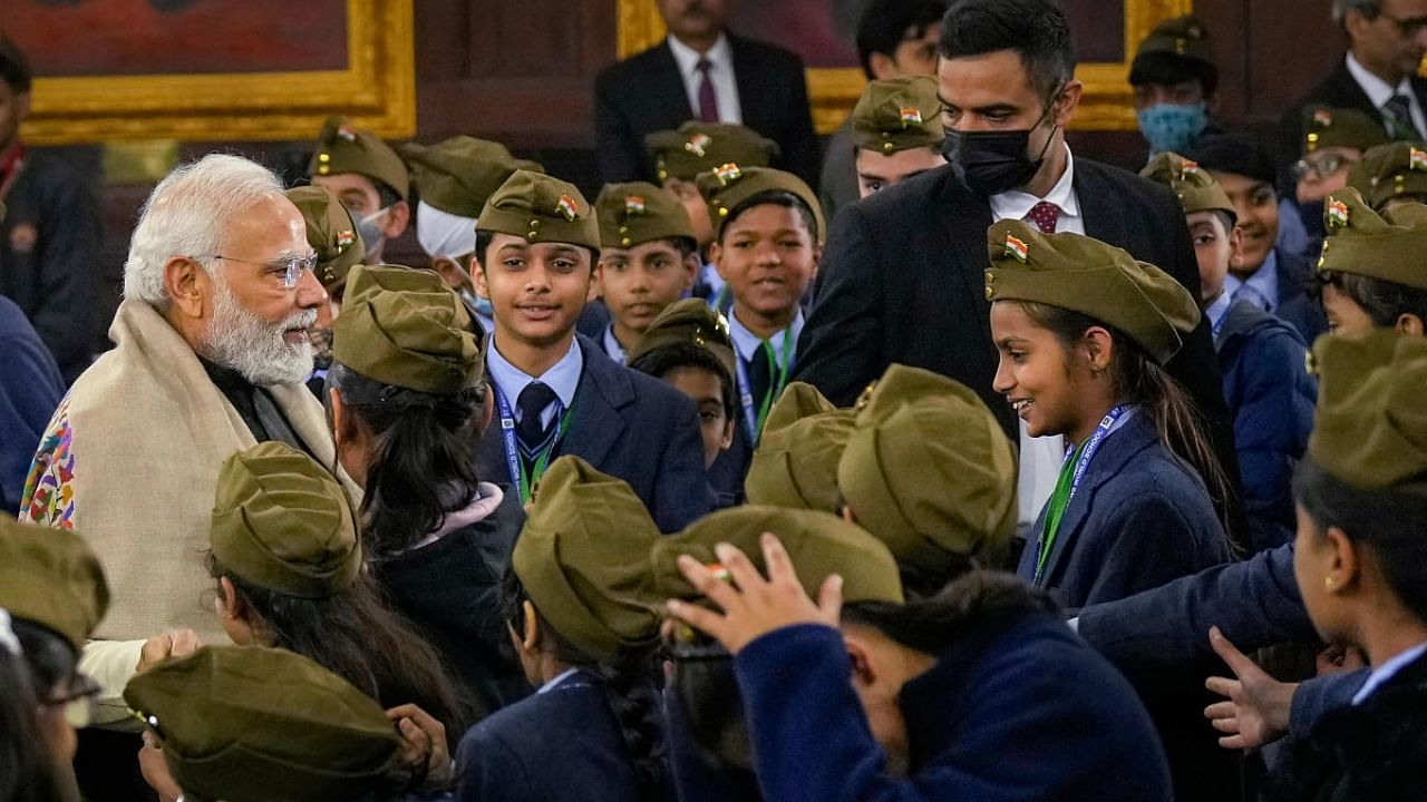 Prime Minister Narendra Modi interacts with students after paying floral tribute to Netaji Subhas Chandra Bose on his 126th birth anniversary, at the Central Hall of Parliament House, in New Delhi, Monday, Jan. 23, 2023. Credit: PTI Photo