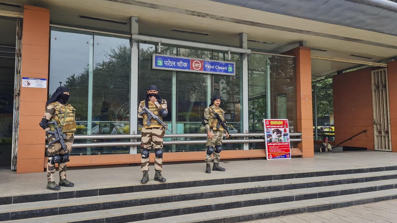 Security personnel stand guard outside Patel Chowk metro station after security was beefed up ahead of the Republic Day celebrations, in New Delhi, Tuesday, Jan. 24, 2023. Credit: PTI Photo
