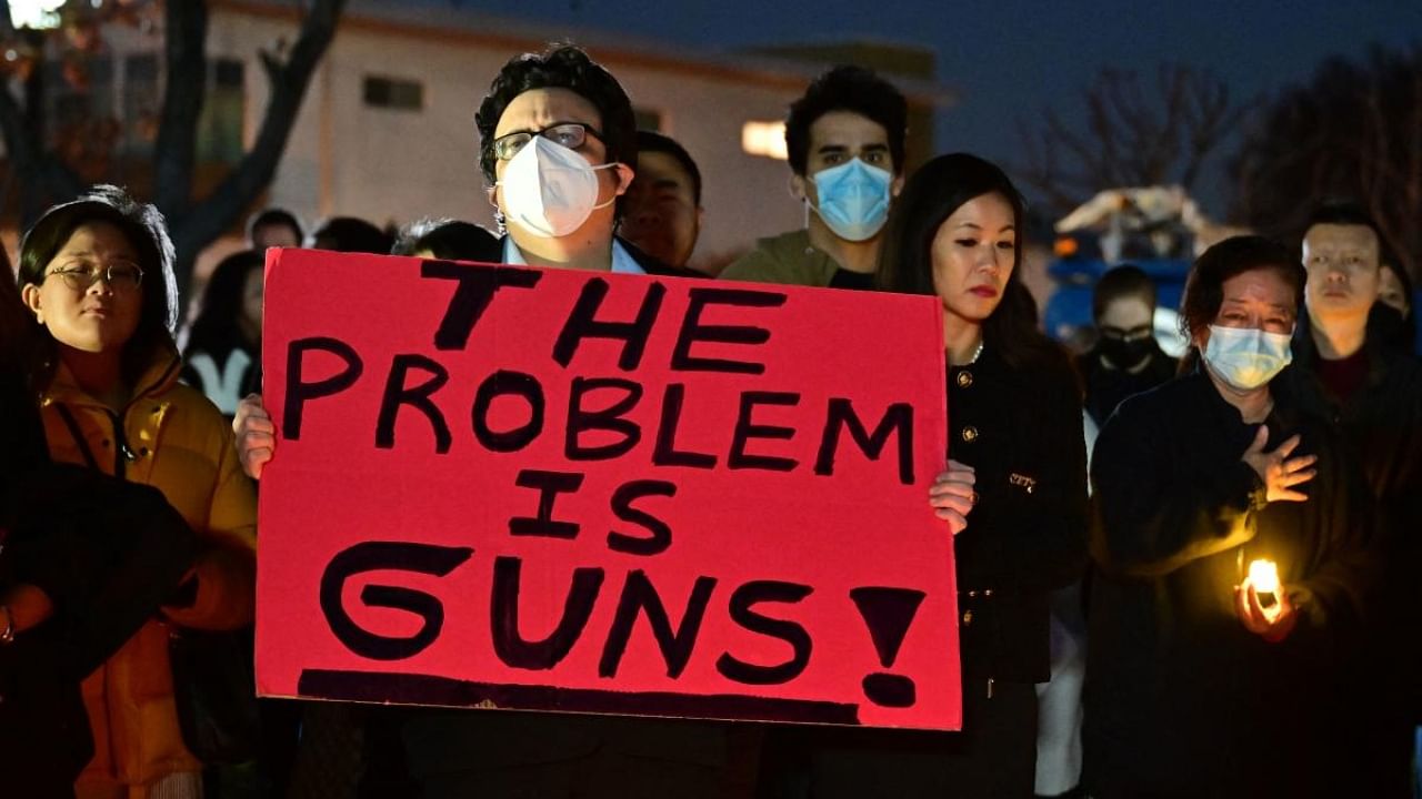 People attend a candle light vigil for victims of a mass shooting in front of the City Hall in Monterey Park, California. Credit: AFP Photo