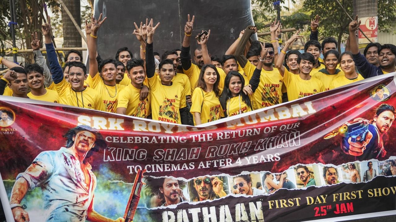 Shahrukh Khan Fans Club members outside theatre during the first day first show of Bollywood movie 'Pathaan'. Credit: PTI Photo