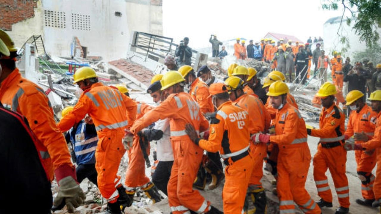 Rescue operation underway after the collapse of a four-storey residential building in the Hazratganj area, in Lucknow. Credit: PTI Photo