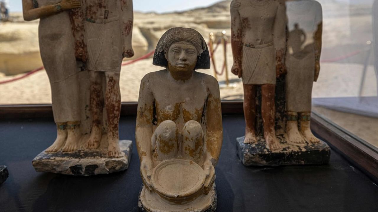 Artifacts are displayed at the Saqqara archaeological site, where a gold-laced mummy and four tombs including of an ancient king's "secret keeper" were recently discovered, south of Cairo on January 26, 2023. Credit: AFP Photo