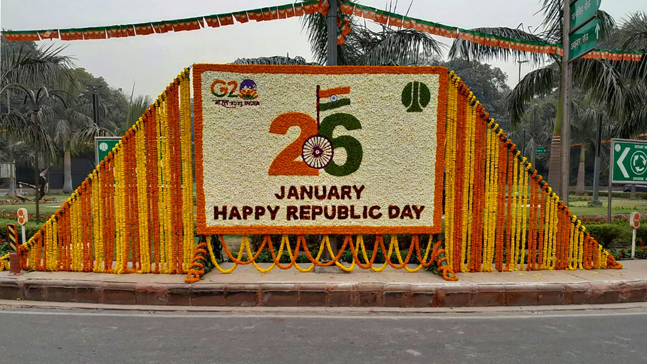 An NDMC board decorated with flowers on the eve of the 74th Republic Day in New Delhi. Credit: PTI Photo