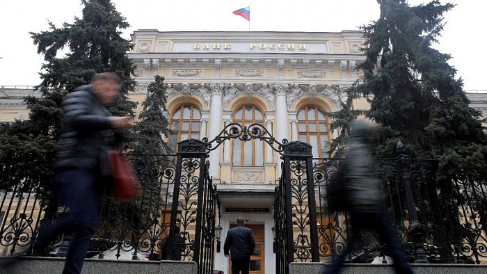 People walk past the Central Bank headquarters in Moscow. Credit: Reuters File Photo