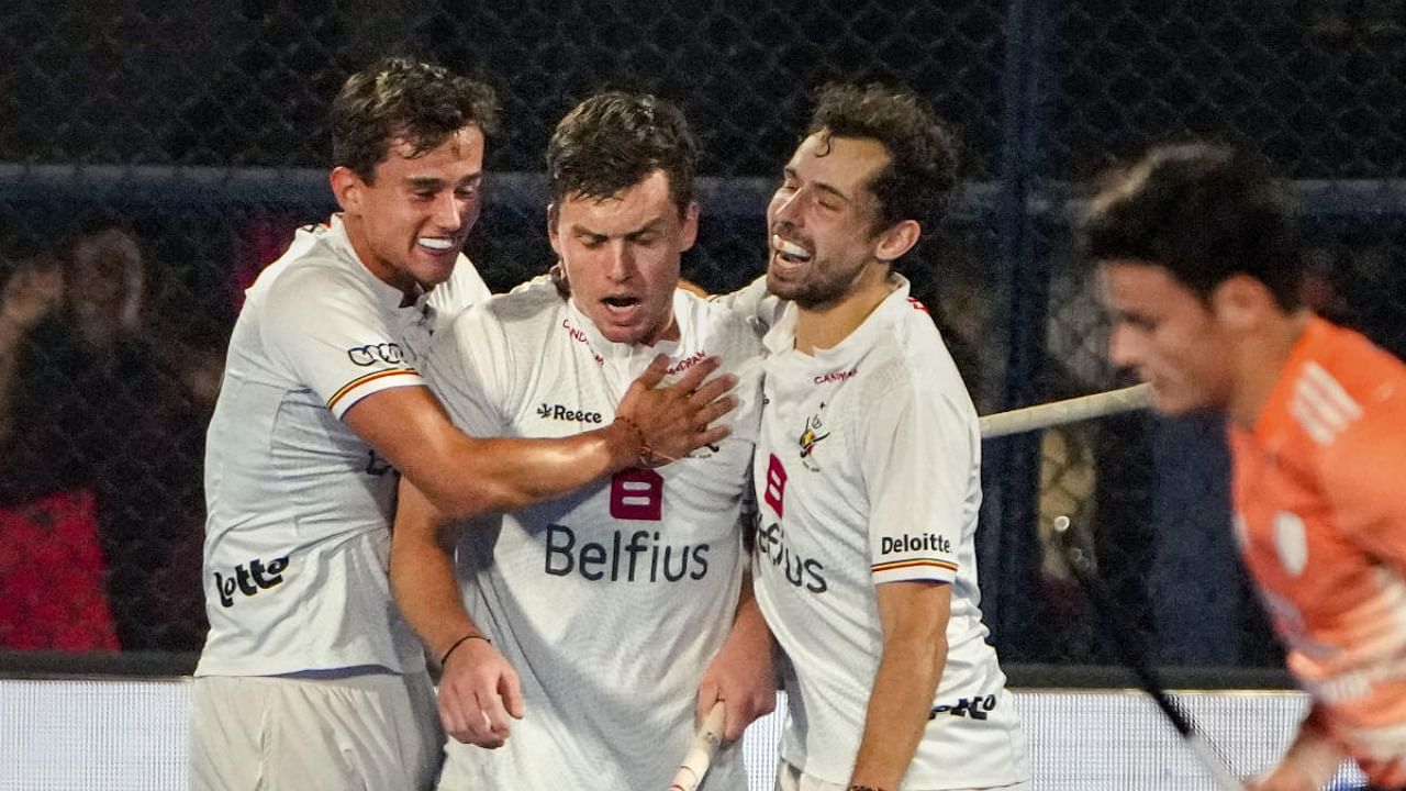 Belgium's Tom Boon (centre) celebrates with teammates after scoring the first goal against Netherlands during the 2023 Men's FIH Hockey World Cup semi-final match between Belgium and Netherlands, in Bhubaneswar, Friday, Jan. 27, 2023. Credit: PTI Photo