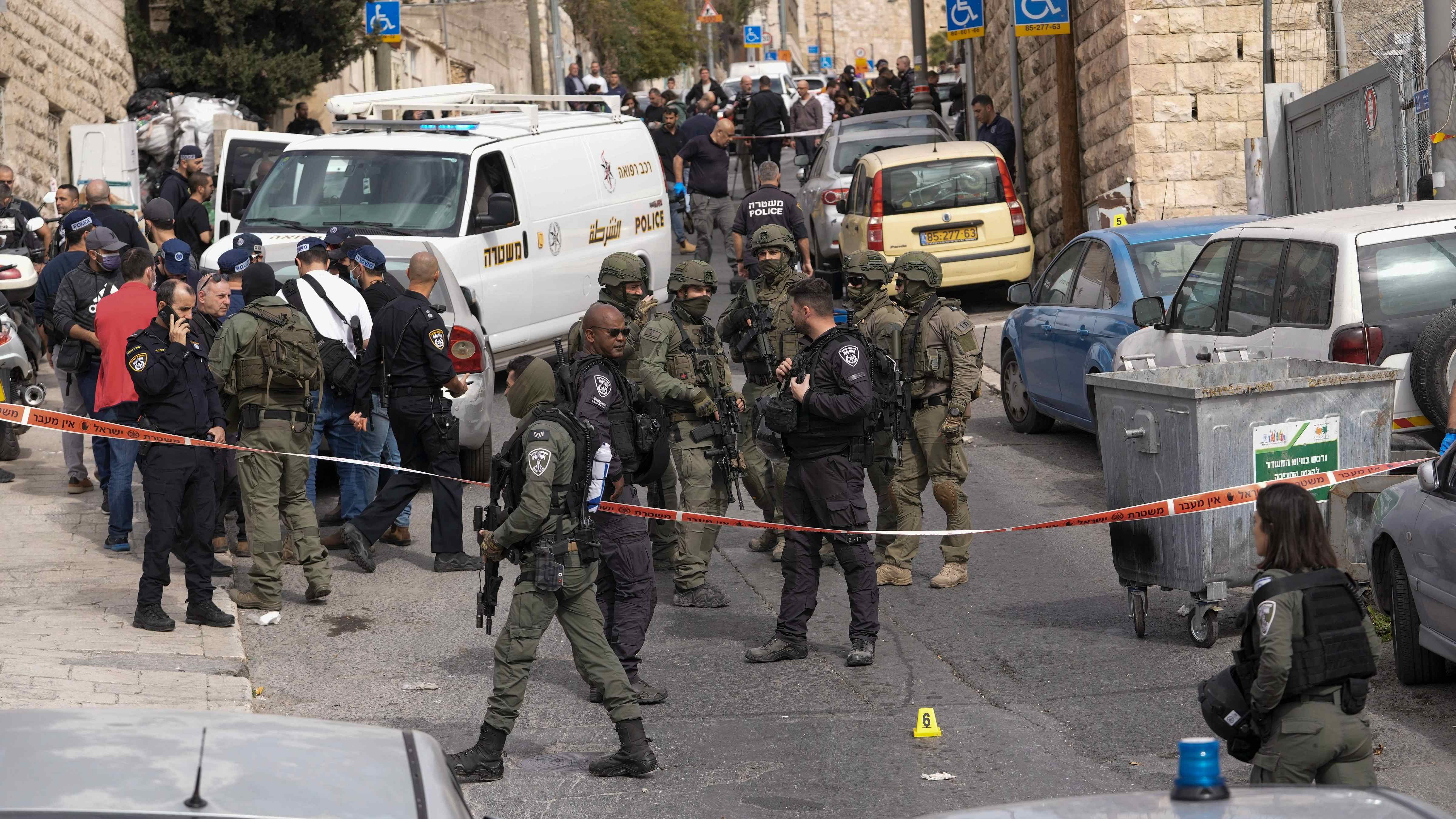 An Israeli policeman secures a shooting attack site in east Jerusalem. Credit: AP/PTI Photo
