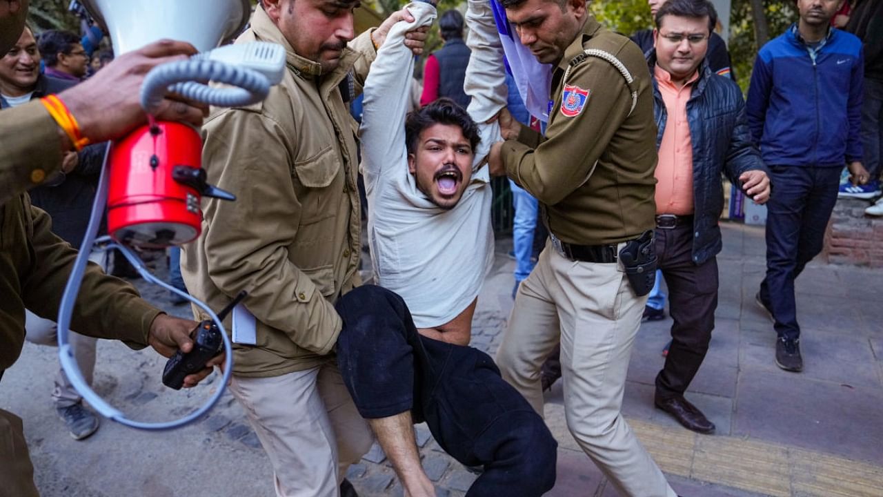 Police personnel detain members of Bhim Army Student Federation for planning to screen the BBC documentary film ‘India: The Modi Question’, at Delhi University Arts Faculty, in New Delhi. Credit: PTI Photo