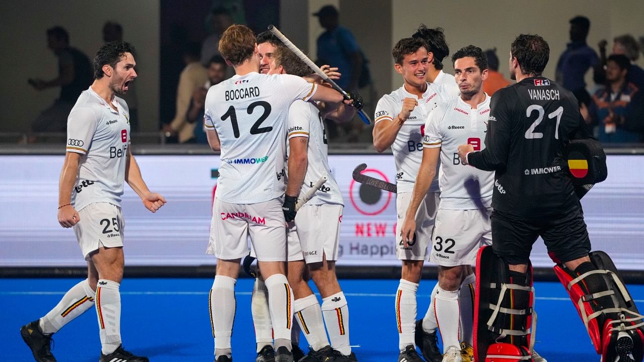 The Belgium team reacts after winning in the penalty shootout against Netherlands during their 2023 Men's FIH Hockey World Cup semi-final match, in Bhubaneswar, Friday, Jan. 27, 2023. Credit: PTI Photo
