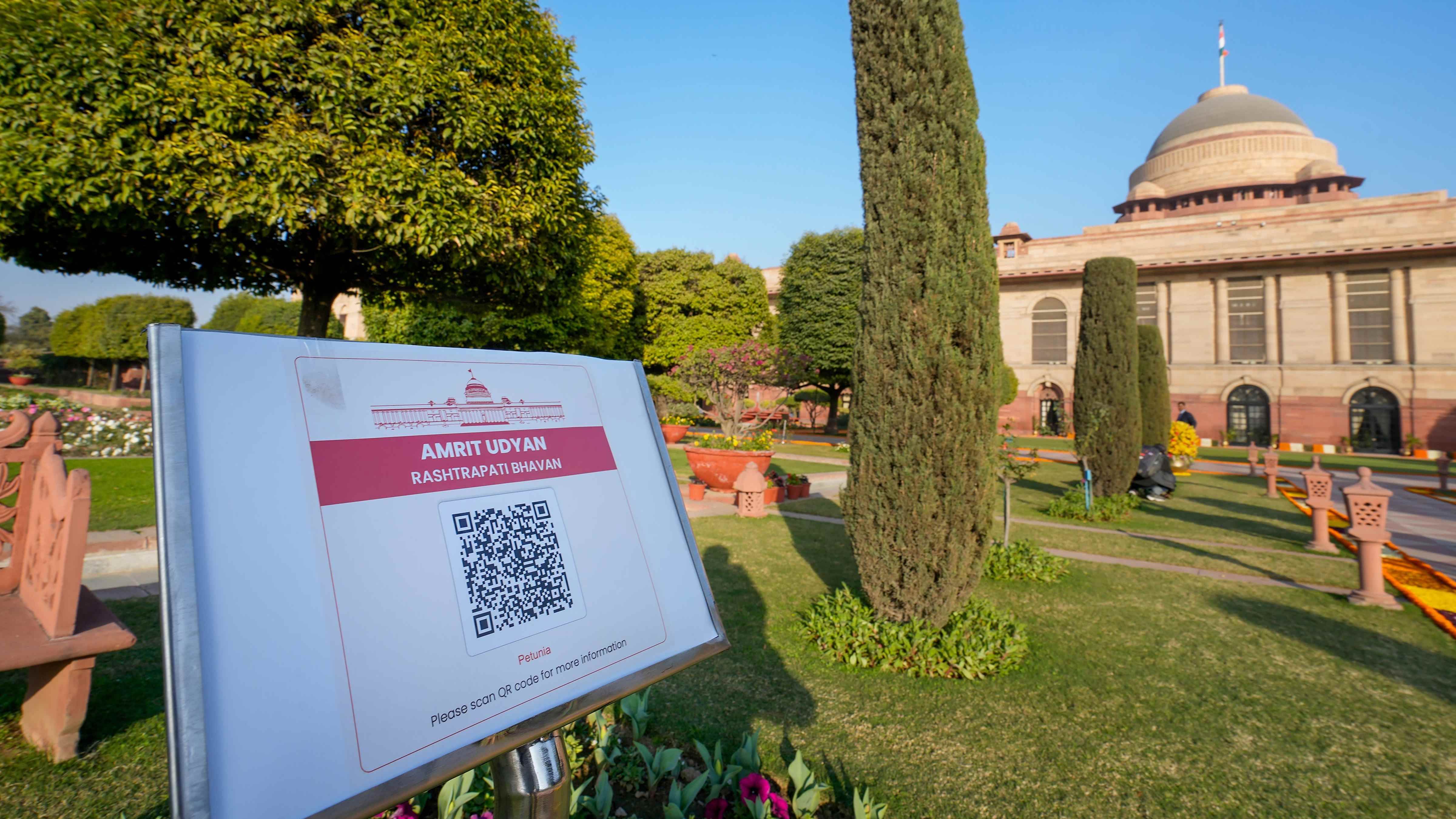 A signboard with a QR code having information about the flower species mentioned below the code at 'Amrit Udyan' on the premises of the Rashtrapati Bhavan. Credit: PTI Photo