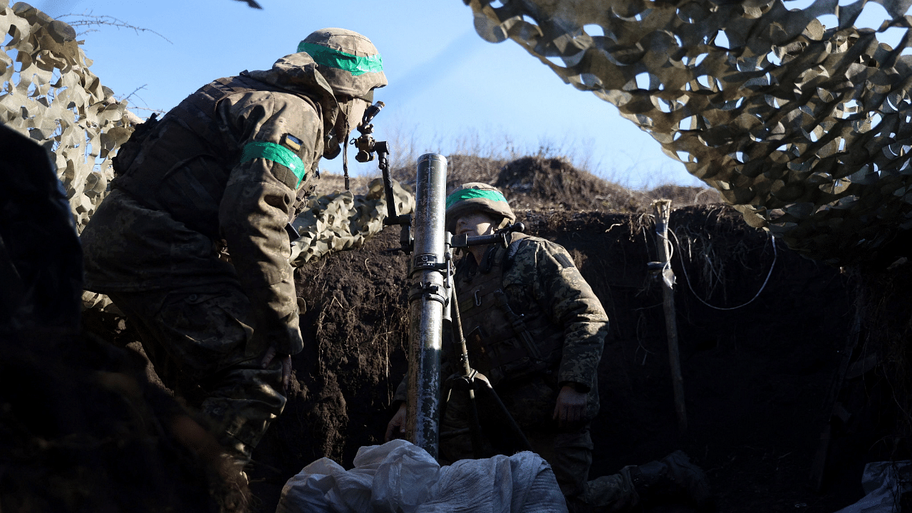 A Ukrainian serviceman gets ready to fire with a mortar from a position not far from Bakhmut, Donetsk region. Credit: AFP Photo